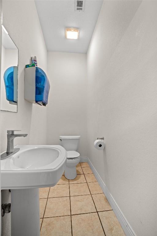 18917 Peckham Dr, Point Venture, TX 78645 - bathroom with toilet and tile patterned floors
