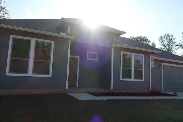 126 E Pauwela Ln, Bastrop, TX 78602 - rear view of property featuring a garage