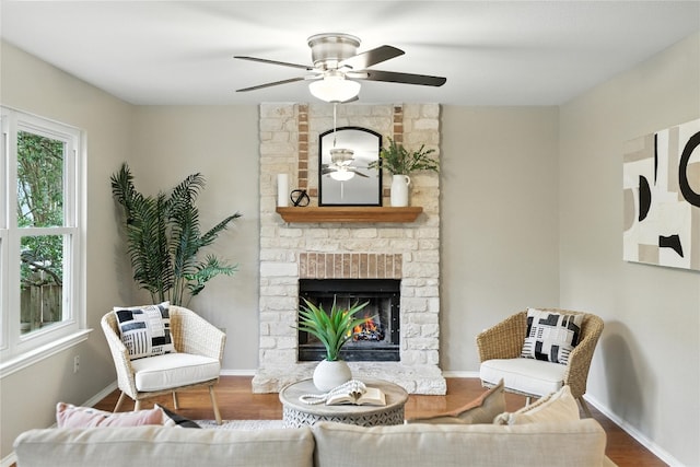 11003 Watchful Fox Dr, Austin, TX 78748 - living area featuring a ceiling fan, a brick fireplace, and wood finished floors