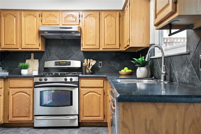 11003 Watchful Fox Dr, Austin, TX 78748 - kitchen featuring stainless steel range with gas stovetop, extractor fan, dark countertops, and decorative backsplash