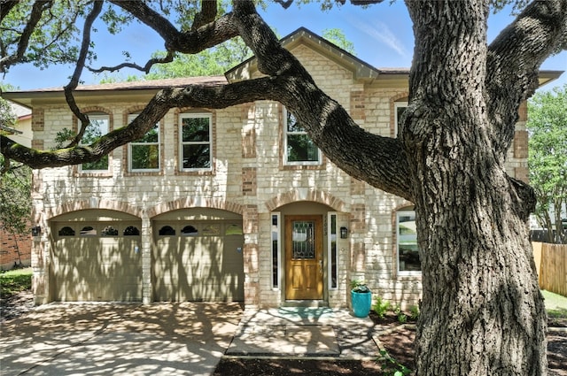 11003 Watchful Fox Dr, Austin, TX 78748 - view of front facade featuring stone siding, driveway, and an attached garage