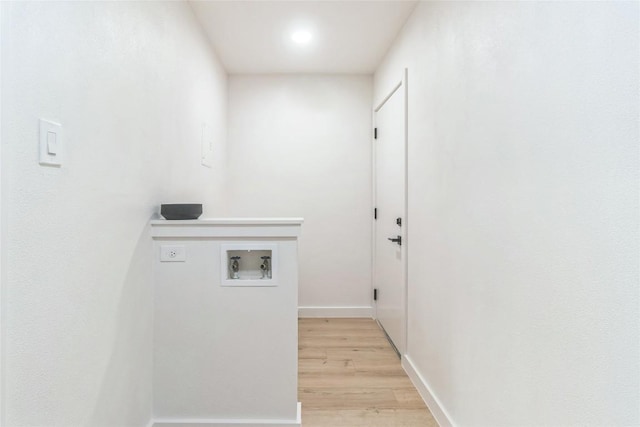 11403 Guernsey Dr, Austin, TX 78758 - laundry area featuring hookup for a washing machine and light wood finished floors