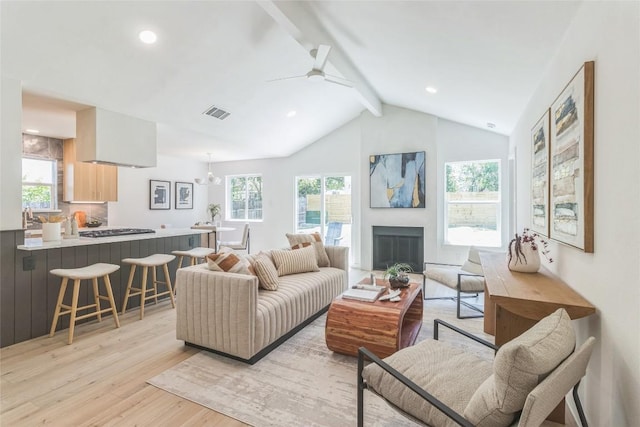 11403 Guernsey Dr, Austin, TX 78758 - living room with light wood-type flooring, ceiling fan, a fireplace, and recessed lighting