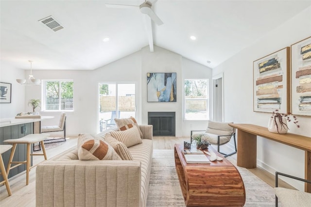 11403 Guernsey Dr, Austin, TX 78758 - living room with light wood-type flooring, a ceiling fan, a fireplace, and recessed lighting