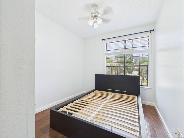 2300 Leon St Unit 205, Austin, TX 78705 - bedroom with wood finished floors and a ceiling fan