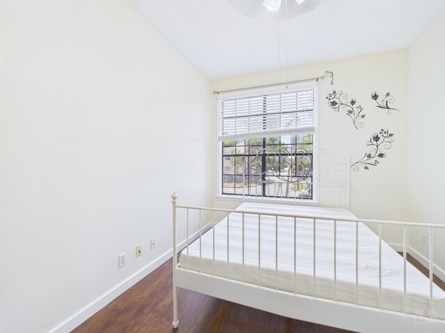 2300 Leon St Unit 205, Austin, TX 78705 - unfurnished bedroom featuring wood finished floors and baseboards