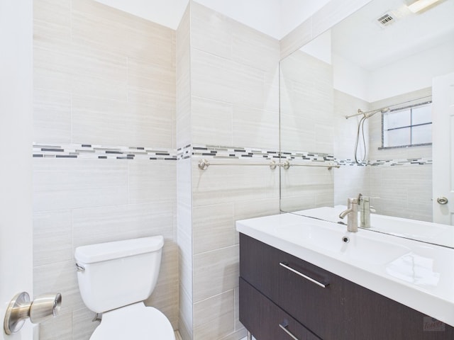 2300 Leon St Unit 205, Austin, TX 78705 - full bathroom with tile walls, vanity, and tiled shower