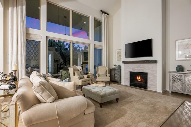 202 Hazy Hills Loop, Dripping Springs, TX 78620 - living area with a towering ceiling and a stone fireplace