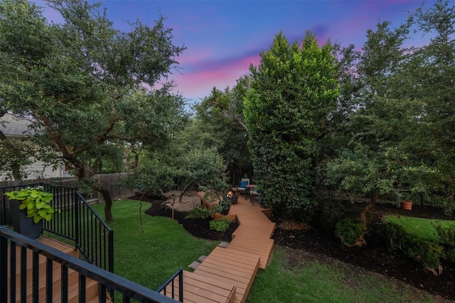 202 Hazy Hills Loop, Dripping Springs, TX 78620 - yard at dusk with a patio area