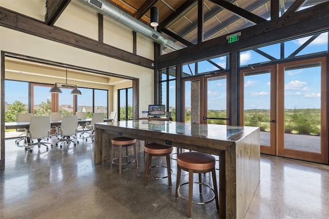 202 Hazy Hills Loop, Dripping Springs, TX 78620 - dining space featuring french doors, finished concrete floors, and an office area