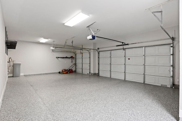 1901 Phantom Horse, Leander, TX 78641 - garage featuring a garage door opener and baseboards