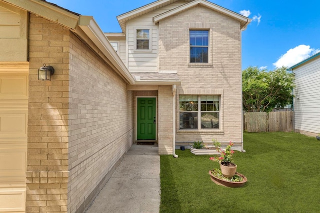 201 Windridge Dr N, Lockhart, TX 78644 - entrance to property featuring brick siding and an attached garage