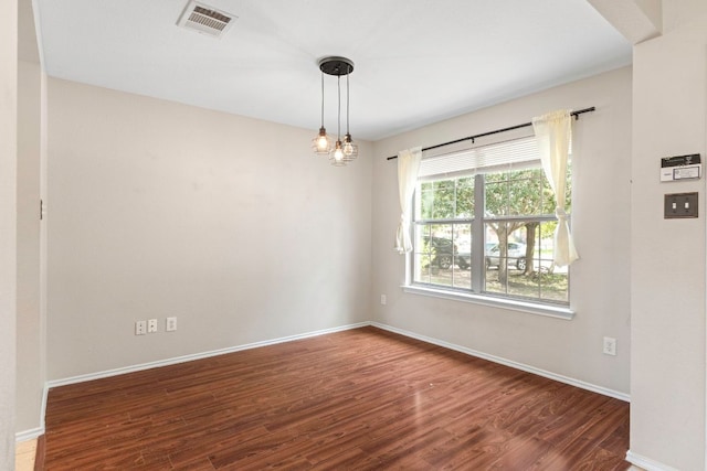 201 Windridge Dr N, Lockhart, TX 78644 - empty room with wood finished floors and baseboards