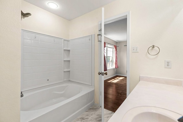 201 Windridge Dr N, Lockhart, TX 78644 - full bathroom with vanity and marble look tiles