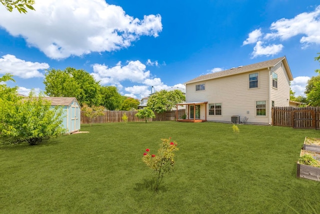 201 Windridge Dr N, Lockhart, TX 78644 - fenced backyard featuring a storage unit