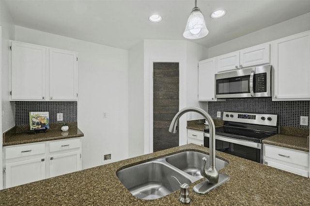 2309 New Hope Spur, Cedar Park, TX 78613 - kitchen featuring stainless steel appliances, white cabinets, backsplash, and recessed lighting