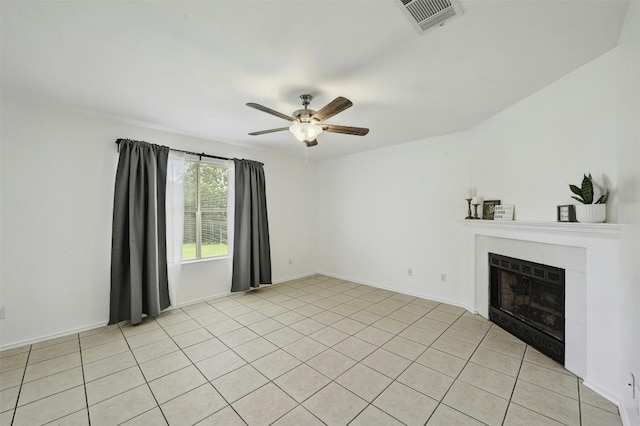 2309 New Hope Spur, Cedar Park, TX 78613 - unfurnished living room with a ceiling fan, a tile fireplace, and light tile patterned floors