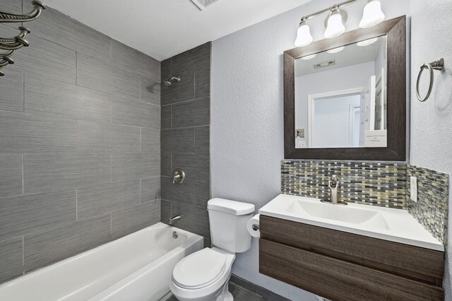 2309 New Hope Spur, Cedar Park, TX 78613 - bathroom with shower / washtub combination, vanity, a textured wall, and tasteful backsplash