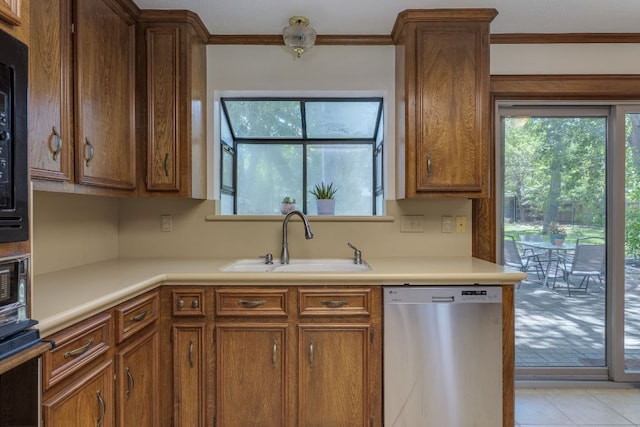 506 Applewood Dr, Pflugerville, TX 78660 - kitchen featuring dishwasher, oven, light countertops, plenty of natural light, and ornamental molding