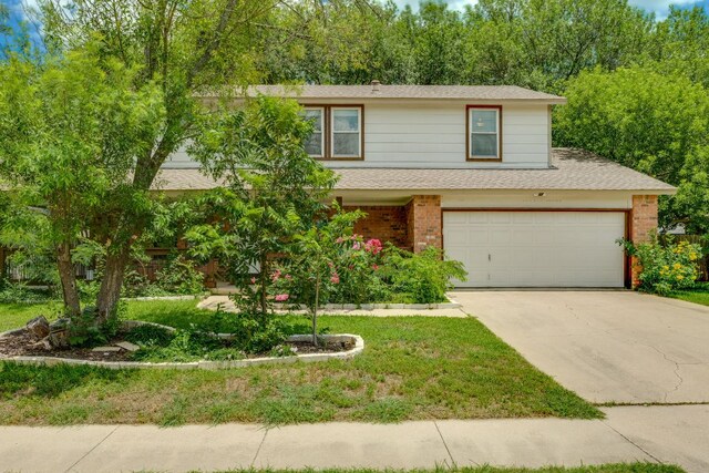 506 Applewood Dr, Pflugerville, TX 78660 - view of front of house featuring driveway, brick siding, roof with shingles, and a garage