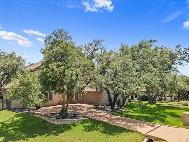 103 El Norte Ct, Lakeway, TX 78734 - view of front of property featuring concrete driveway, a garage, and brick siding
