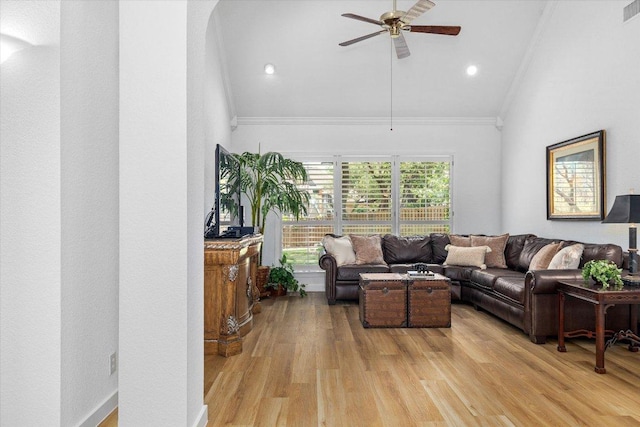 103 El Norte Ct, Lakeway, TX 78734 - living area with ornamental molding, ceiling fan, light wood-style flooring, vaulted ceiling, and arched walkways
