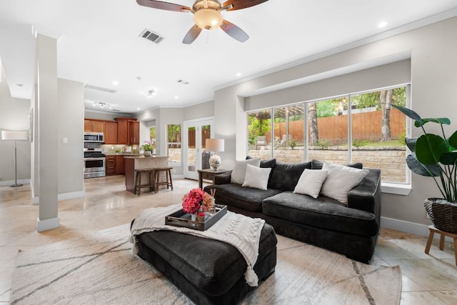 10919 Sierra Oaks, Austin, TX 78759 - living room with ornamental molding, healthy amount of natural light, ceiling fan, and recessed lighting