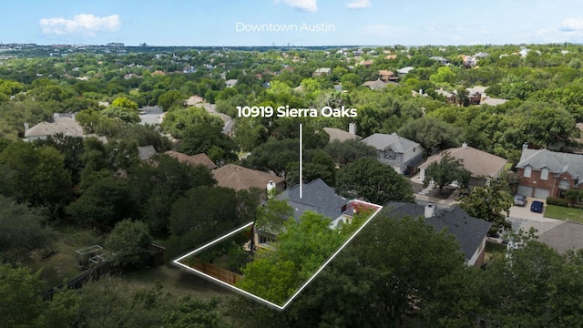 10919 Sierra Oaks, Austin, TX 78759 - aerial view of property and surrounding area with property parcel outlined and nearby suburban area