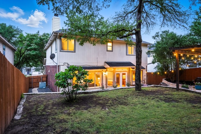 10919 Sierra Oaks, Austin, TX 78759 - rear view of property featuring a fenced backyard and a chimney
