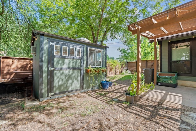 2717 Jorwoods Dr, Austin, TX 78745 - view of shed with a fenced backyard and a pergola