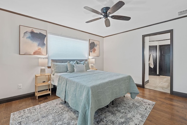 2717 Jorwoods Dr, Austin, TX 78745 - bedroom featuring wood finished floors, ceiling fan, and ornamental molding