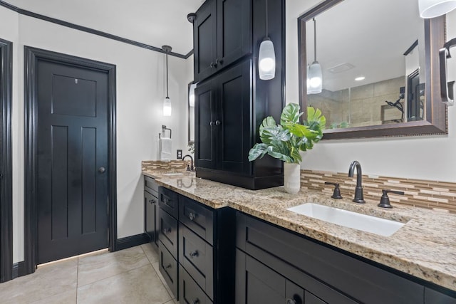 2717 Jorwoods Dr, Austin, TX 78745 - bathroom featuring double vanity, a tile shower, tile patterned floors, and backsplash