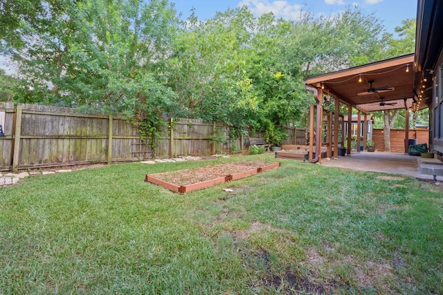 2717 Jorwoods Dr, Austin, TX 78745 - fenced backyard with a ceiling fan, a patio, and a garden