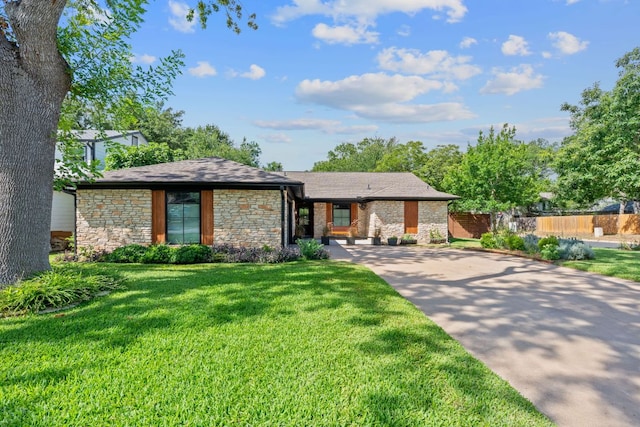 2717 Jorwoods Dr, Austin, TX 78745 - view of front facade with stone siding and driveway