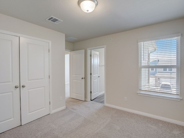 1850 Settlers Glen Dr Unit 404, Round Rock, TX 78665 - unfurnished bedroom with light colored carpet and a closet