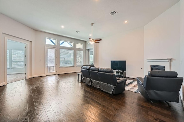 6716 Calabria Dr, Round Rock, TX 78665 - living room featuring dark wood-type flooring, a fireplace, ceiling fan, and recessed lighting