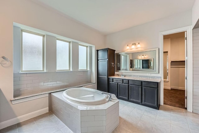 6716 Calabria Dr, Round Rock, TX 78665 - full bath with vanity, a garden tub, and tile patterned floors