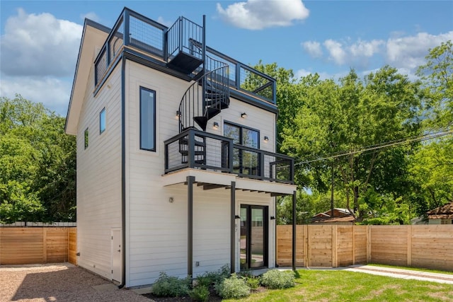 87 Chalmers Ave, Austin, TX 78702 - back of property featuring a balcony and stairway