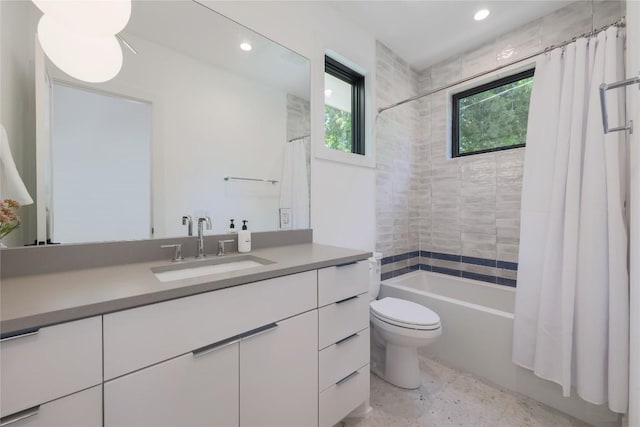 87 Chalmers Ave, Austin, TX 78702 - bathroom featuring vanity, shower / bathtub combination with curtain, and recessed lighting