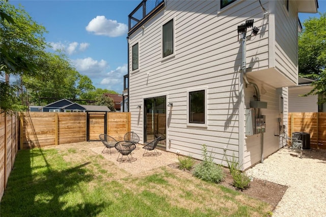 87 Chalmers Ave, Austin, TX 78702 - back of property with a fenced backyard and a fire pit