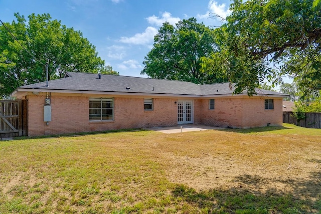 1001 E Applegate Dr, Austin, TX 78753 - back of property with french doors, a patio area, and brick siding