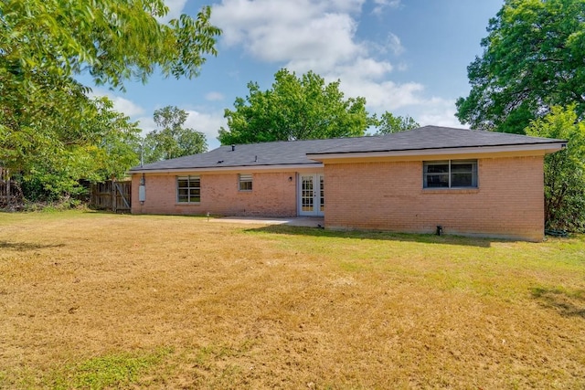 1001 E Applegate Dr, Austin, TX 78753 - rear view of property featuring french doors, brick siding, and a patio area