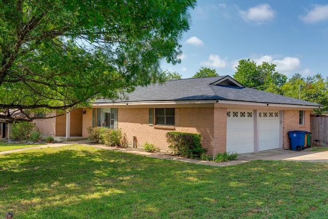 1001 E Applegate Dr, Austin, TX 78753 - ranch-style home featuring brick siding, a garage, driveway, and a front yard