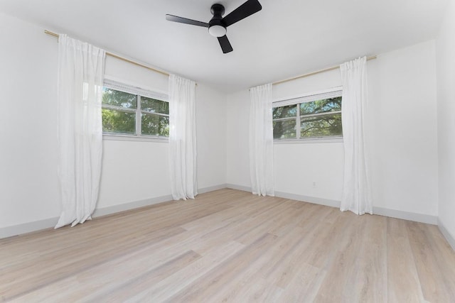 1001 E Applegate Dr, Austin, TX 78753 - empty room featuring plenty of natural light, a ceiling fan, and light wood-type flooring