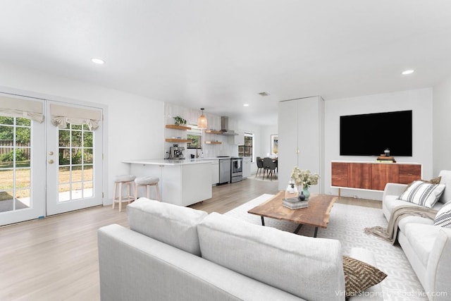 1001 E Applegate Dr, Austin, TX 78753 - living area featuring french doors, light wood-type flooring, and recessed lighting