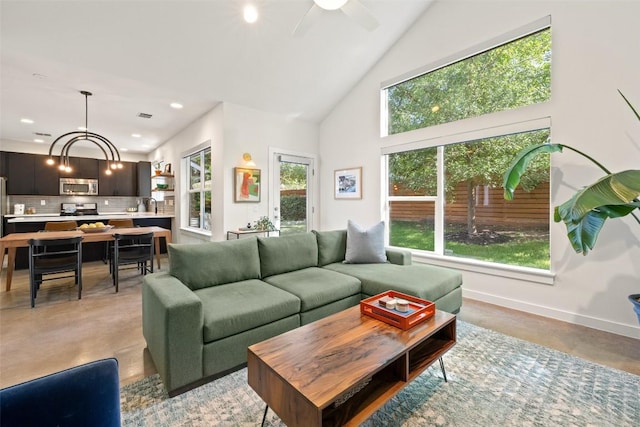 301 W Stassney Ln Unit 11, Austin, TX 78745 - living area with finished concrete flooring, a ceiling fan, high vaulted ceiling, and recessed lighting