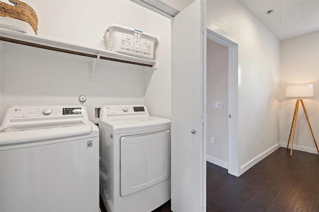 301 W Stassney Ln Unit 11, Austin, TX 78745 - laundry room with washing machine and dryer and dark wood-style flooring