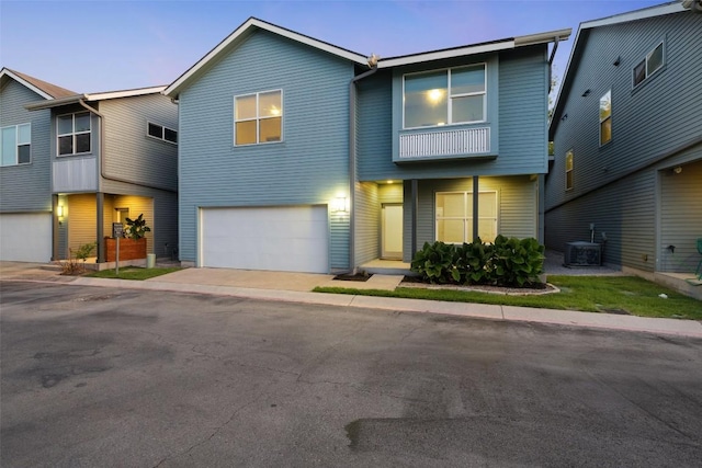 301 W Stassney Ln Unit 11, Austin, TX 78745 - view of property featuring a garage and driveway