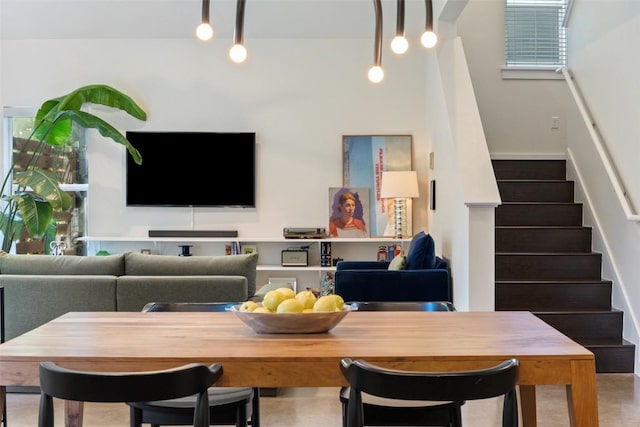 301 W Stassney Ln Unit 11, Austin, TX 78745 - living room featuring stairway, rail lighting, and healthy amount of natural light