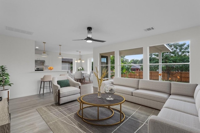 15532 Emmaleighs Ln, Pflugerville, TX 78660 - living room featuring wood finished floors and ceiling fan